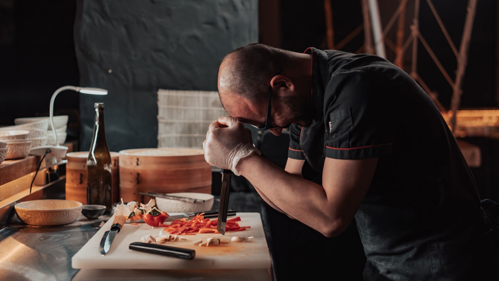 Chef preparing fresh vegetables in a professional restaurant kitchen