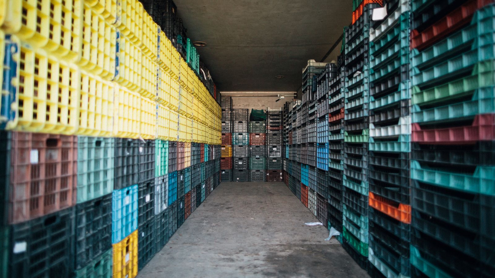 Stacked produce crates in a distribution warehouse